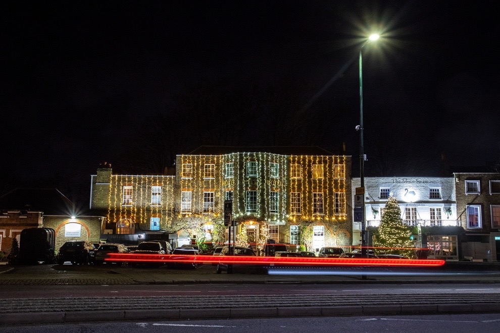 The Mitre Hotel and street lit up at night