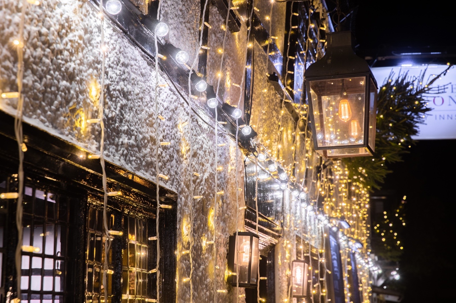 Festoon bulbs, curtain lights and a lantern on the front of the Bell and Dragon in Cookham
